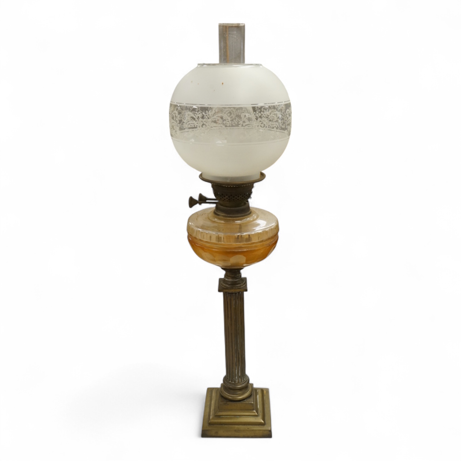 A brass oil lamp with columnar base and etched glass shade, 72cm high overall